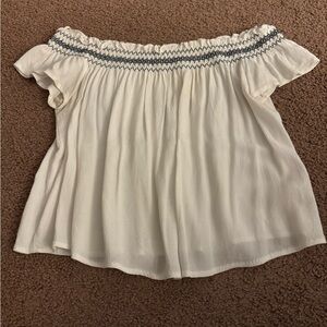 Garage white off the should tee size medium a little see through